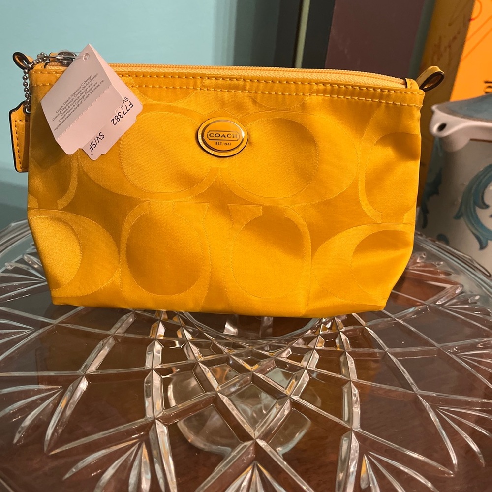 Coach nylon make up bag color sunflower.  NWT